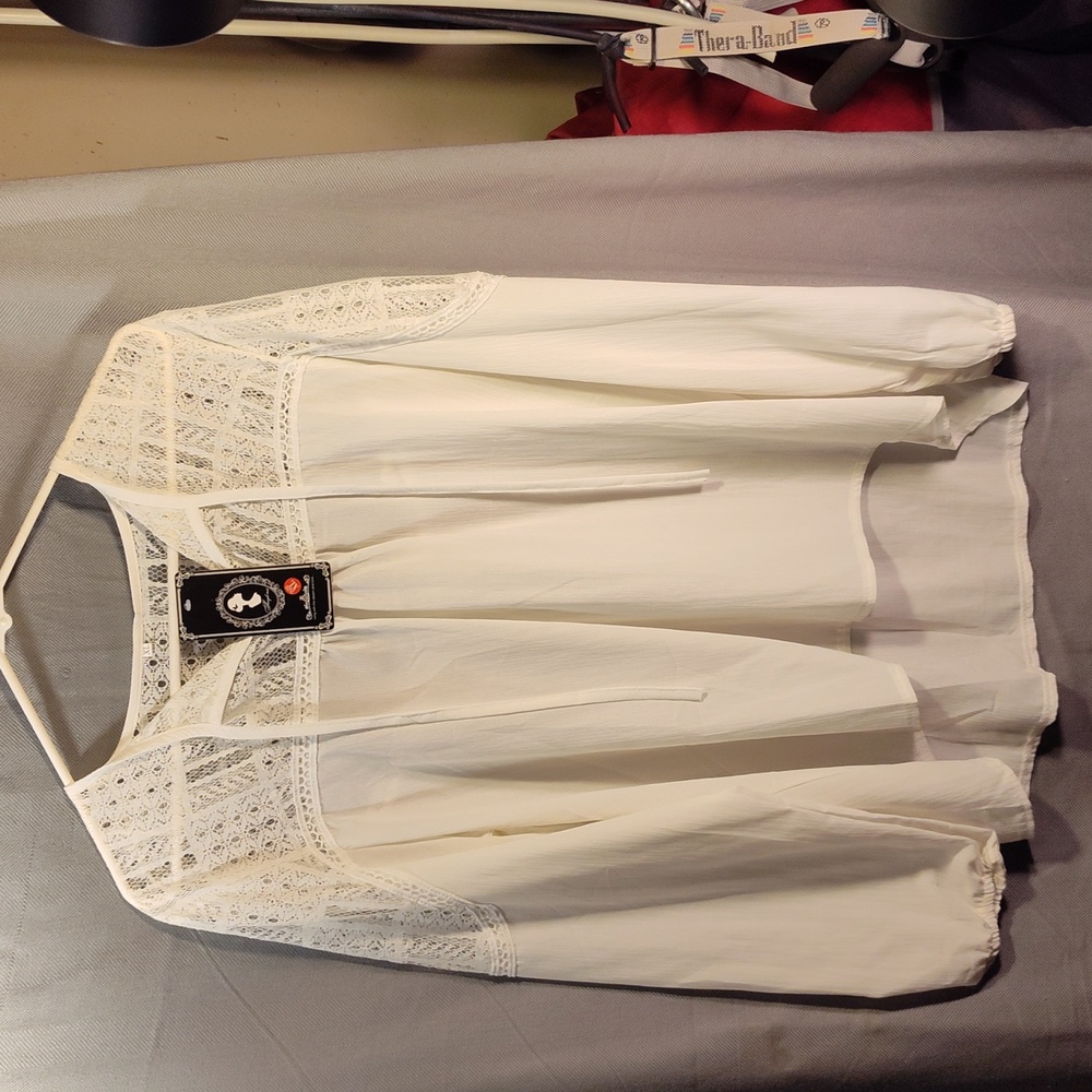 woman's white cream long sleeve blouse